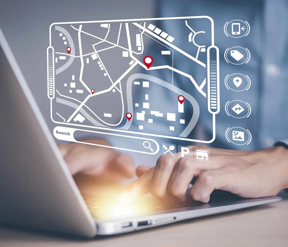 Carte numérique avec points rouges sur un ordinateur portable. Glossaire A-J.