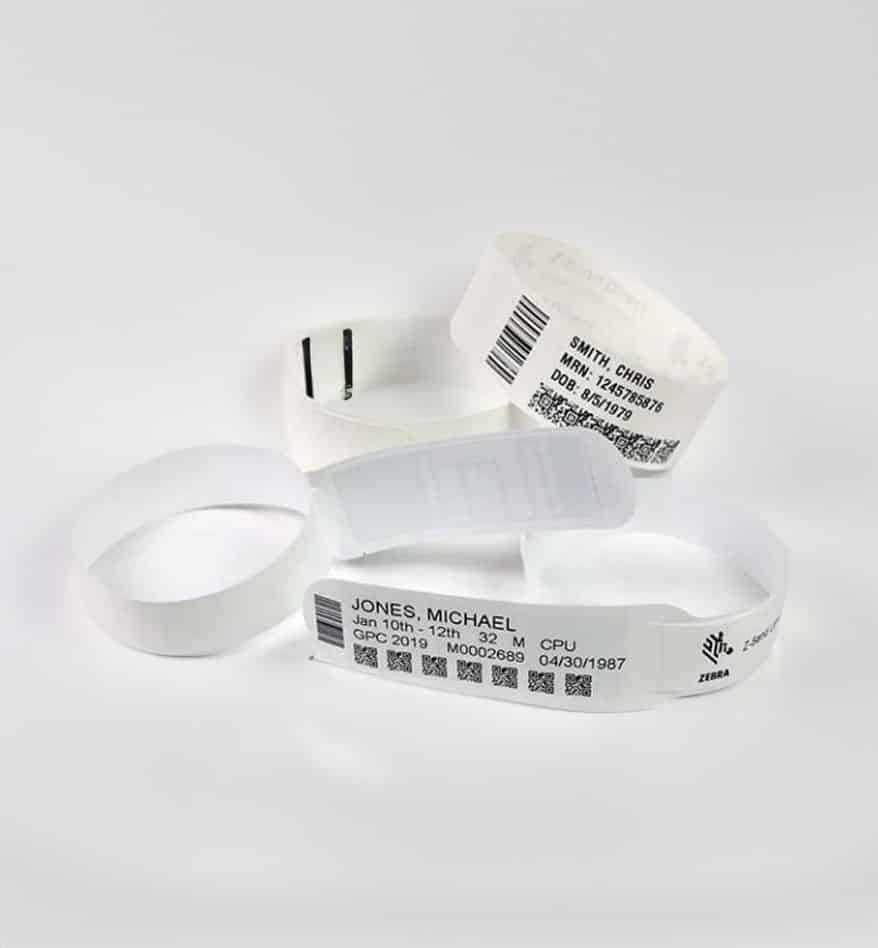 Bracelets d'identification thermique et laser avec informations patient : Jones, Michael et Smith, Chris.